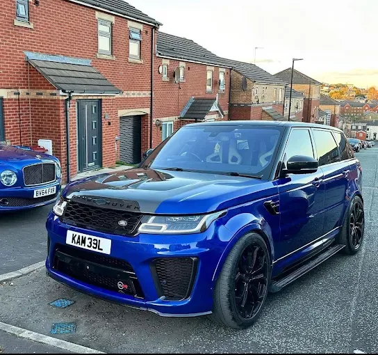 Blue Range Rover parked on a street in Derby